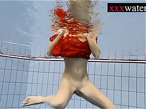 jaw-dropping scorching female swimming in the pool